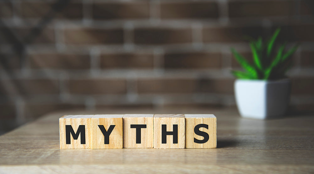 Common CBD myths, block letters spelling out "myths" with green plant in the background.
